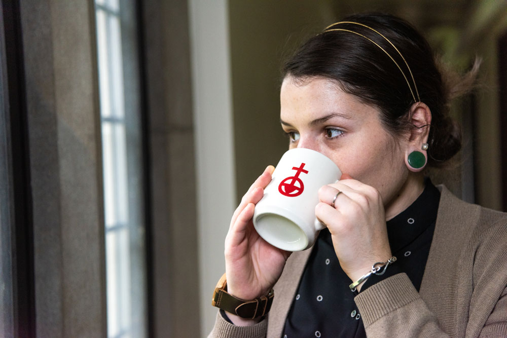 Woman drinking coffee.