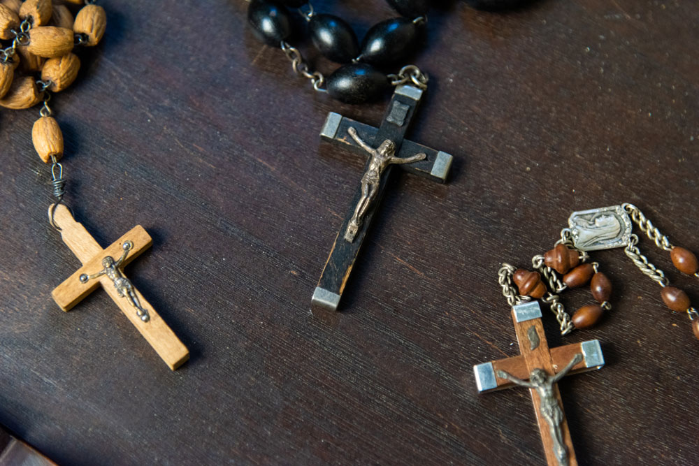 Close up on rosaries available for sale in the gift shop.